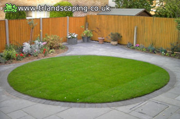 Total Re-Landscaping: Constructed a New Paved Area with Boarders and Created Circular Lawn Feature